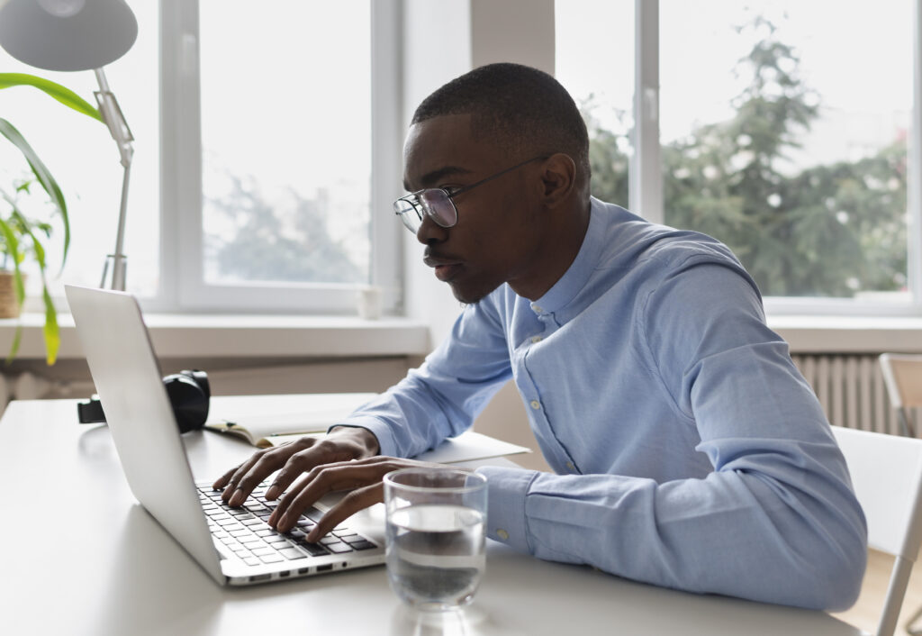 A man blogging with his laptop