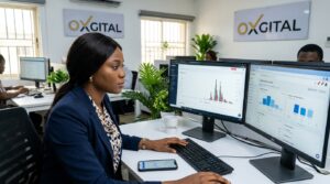 A female social media manager analysing social media analytics on multiple screens inside a modern Nigerian office. One screen displays TikTok growth charts and engagement spikes, while another shows Instagram audience insights and ad performance dashboards.