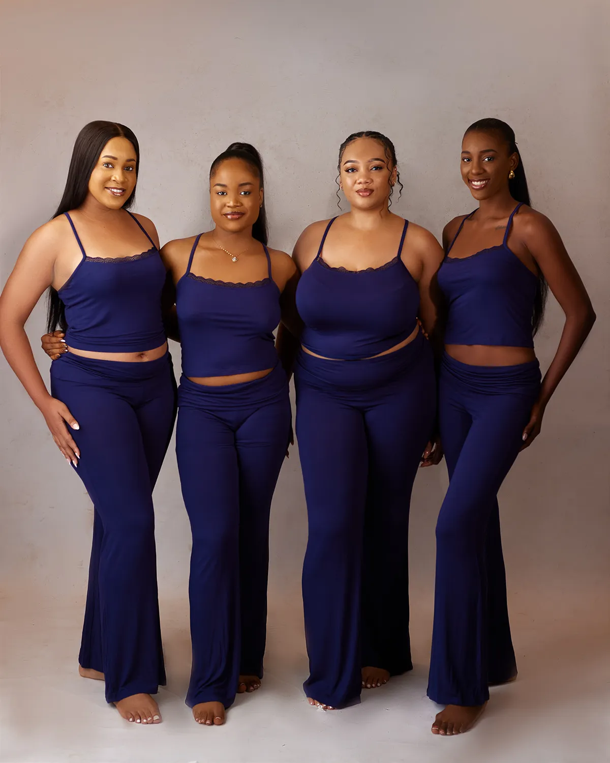 Oxgital-produced group photoshoot featuring models wearing Àlàyò matching sleepwear and loungewear.